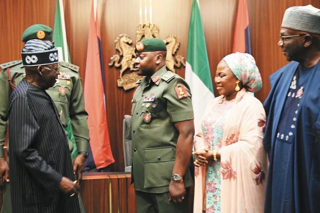 President Bola Tinubu, his ADC, Col. Nurudeen Yusuf, his wife, Ganiyat Yusuf and Chairman of Nigeria Governors Forum (NGF) and Governor of Kwara State, AbdulRahman AbdulRazaq, at the brief ceremony at the State House, Abuja