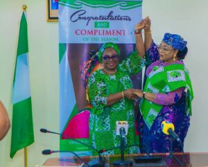 Minister of Women Affairs, Imaan Suleiman-Ibrahim with  Acting National President, National Council of Women Societies (NCWS), Geraldine Etuk, during a courtesy visit in her office,  recently