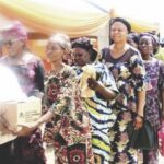 Amaefula presenting food items to the widows