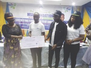 Echiegu, Mbam present cheque to one of the beneficiaries