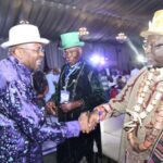 Iyaye (left), in a handshake with Opuiyo (right), during a stakeholder’s interactive forum on the Borikiri-Okrika Bridge project. With them is King Frank (right)