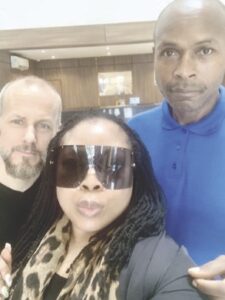 Oboh with Chris and Angela Jorgenson