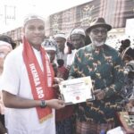 One of the awardees receiving his certificate of recognition