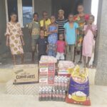 Residents of Yemi Alogi Orphanage Centre with the items donated by the NGO