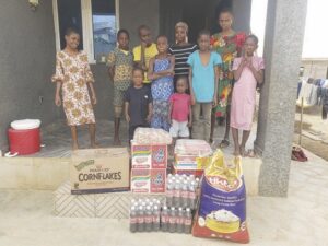 Residents of Yemi Alogi Orphanage Centre with the items donated by the NGO
