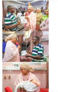Wife of Vice President, Nana Shettima, presenting the birth cartilage to the father of the baby of the year
