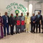Nigerian Officials, led by the Minister of Defence Mohammed Badaru Abubakar  at the signing of the Memorandum of Understandng (MoU) between AU and Nigeria for strategic sea lift services