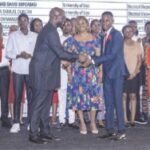 Durotoye presenting an award to one of the students