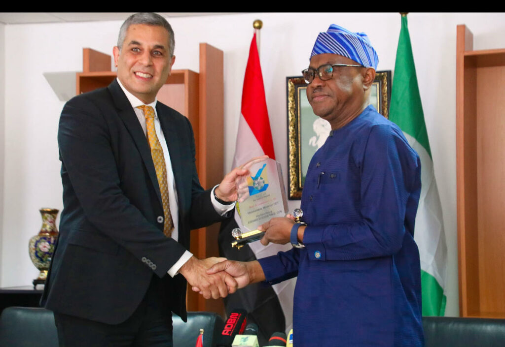 FCT Minister Nyesom Wike (r) presents a gift to the visiting Egyptian Ambassador to Nigeria, Mohammed Fouad in his office on Thursday