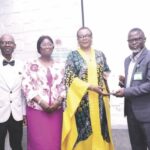 L-R- Olaseni; wife; Lawanson and Badmus, presenting plaque to Lawanson