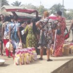 Retailers loading their wares in a vehicle.