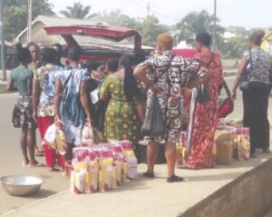 Retailers loading their wares in a vehicle.