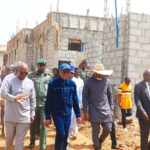 FCT Minister Nyesom Wike (m) flanked by Ag. ES FCDA, Richard Dauda (1st left) and  Adapoyi, MD Details2Dot Development Nig. (2nd right) during the Minister’s inspection of construction of judges quarters in Abuja on Wednesday