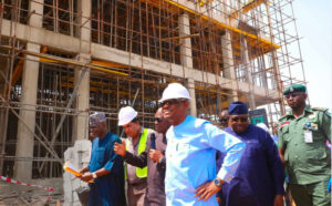 FCT Minister Nyesom Wike (3rd tight) flanked by Ag. ES, FCDA Richard Dauda (3rd left), Philip Aduda (2nd)) right) and other senior officials of the FCTA during his inspection of works on the Abuja Division of the Court of Appeal on Thursday