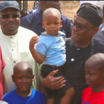 FCT Minister Nyesom Wike with Godswill, Godspower, and Godstime, children of the Chairman, Kwali Area Council, Danladii Chiya (1st left) and Senator Philip Aduda (2nd left) during the Minister’s project inspection visit to Kwali on Saturday, February 15, 2025