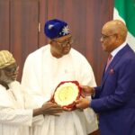 FCT Minister Nyesom Wike (right) being presented a gift by the Chairman, Body of Benchers, Adegboyega Awomolo and Vice Chairman Kayode Ariwoola during the visit if the Body of Benchers to the Minister on Friday