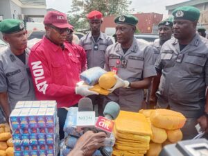 Ogun Customs boss, Mohammed Shuaib, handing over seized illicit drugs to the authorities of the NDLEA