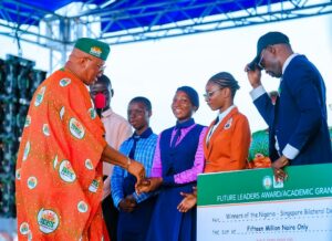 Gov Umo Eno addressing beneficiaries of empowerment programme