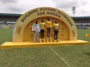 Suzan Christopher (m) gold medalist in Discus flanked by other athletes at the just concluded MTN Champs Season 3 competition held at the Samuel Ogbemudia Stadium, Benin City