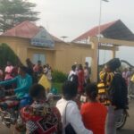 Students protesting at the gate of Akwa Ibom state Polytechnic ,Ikot Osurua on Monday