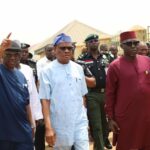 FCT Minister Nyesom Wike (m) flanked by the Ag ES, FCDA, Richard Dauda (left) and Director Development Control TPL Mukhrar Galadima (right) at Gishiri village during an inspection of obstructions to construction of the arterial road N16 in Abuja on Tuesday