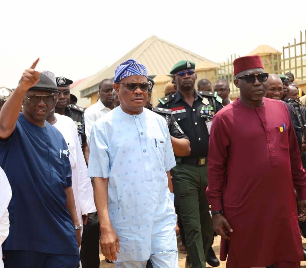 FCT Minister Nyesom Wike (m) flanked by the Ag ES, FCDA, Richard Dauda (left) and Director Development Control TPL Mukhrar Galadima (right) at Gishiri village during an inspection of obstructions to construction of the arterial road N16 in Abuja on Tuesday