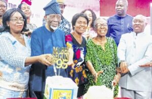 Marbel Seun flanked by family and friends