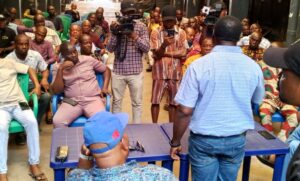 NAFDAC official addressing the traders