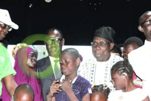 Obasanjo with beneficiaries of the free hearing aids
