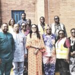 Onyejiocha with her entourage and staff of the company