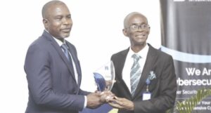Prof. Tayo (left) presenting plaque to Senator Salisu