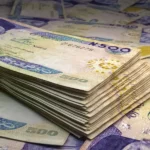 nigerian-money-naira-banknotes-ngn-polymer-bills-nigeria-business-finance-news-background-222058464