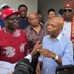 Anambra Governor Charles Chukwuma Soludo (L) with Arthur Eze (R) speaking to reporters
