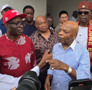 Anambra Governor Charles Chukwuma Soludo (L) with Arthur Eze (R) speaking to reporters