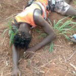 One of the killed persons lays dead on a field