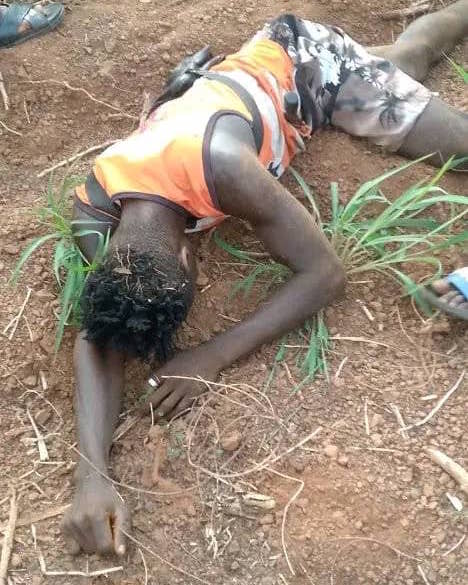 One of the killed persons lays dead on a field