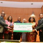 Head of the Civil Service of the Federation (HCSF), Didi Walson-Jack, poses with the Carpooling Team, overall winners of the 5th Annual Federal Public Service Innovation Competition, holding their N5 million prize cheque. The award ceremony recognized their innovative solution among over 155 entries, reinforcing the government’s commitment to fostering innovation in the civil service