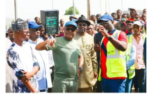 FCT Minister Nyesom Wike (m) stressing a point to Otunba Abdullahi Sulaiman Bello, MD, Abdul Val Ltd during the Minister’s inspection of the Ushafa-War College road in Bwari on Saturday