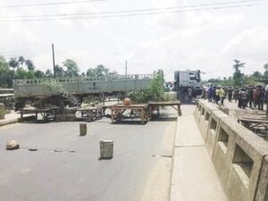 Angry youths barraciding the road