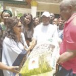 Ani (middle) presenting items to constituents