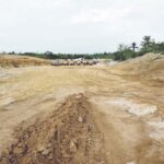 Cleared section of the highway in Awi awaiting construction