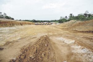Cleared section of the highway in Awi awaiting construction