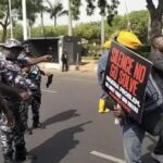 Police and protesters in Abuja