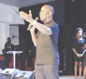 Pastor Ituah addressing the congregation