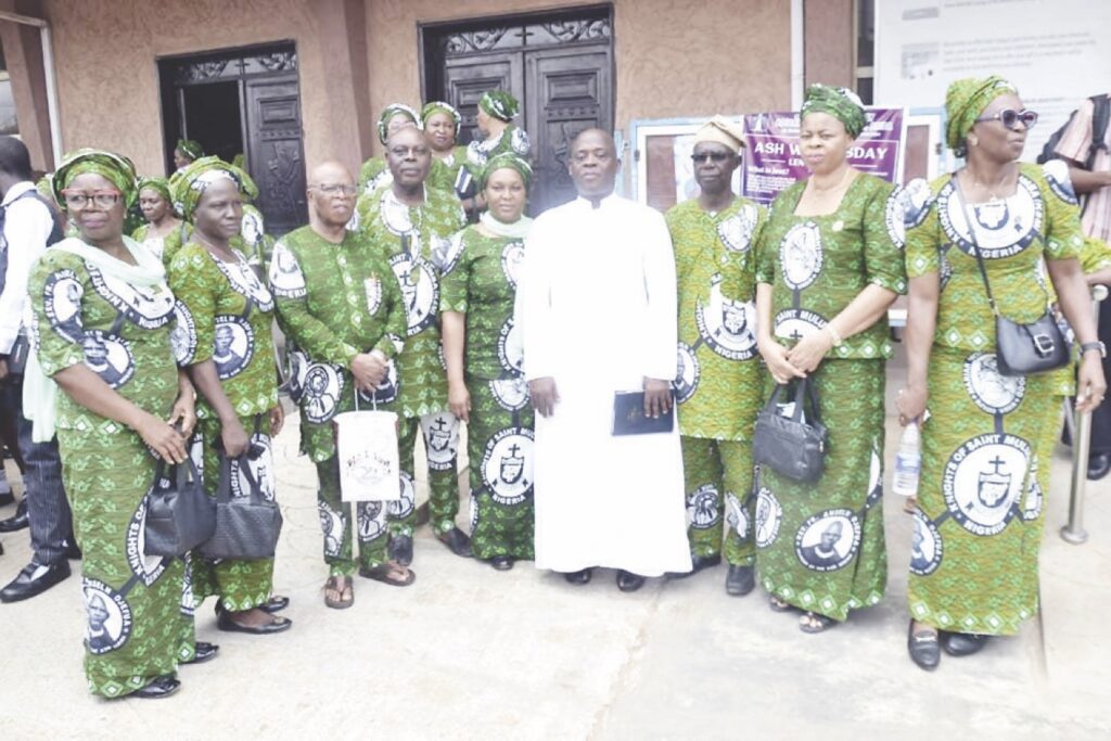 Rev Fr Andrew Abhulime, Worthy Brother Fabian Ewend pose with some members of KLSM