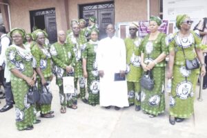 Rev Fr Andrew Abhulime, Worthy Brother Fabian Ewend pose with some members of KLSM