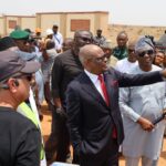 FCT Minister Nyesome Wike examining the plans for the construction of the road into the EFCC Academy in Giri District on Friday