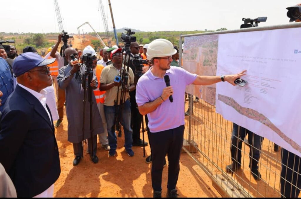FCT Minister Nyesom Wike (left) listening to updates on the Arterial Road N5, from Life Camp Junction to Ring Road 3 (RRIII), being handled by the Regional Manager, Julius Berger PLC, Oliver Berger, during inspection of the road project in Abuja, Thursday, April 24, 2025