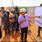 FCT Minister Nyesom Wike (left) listening to updates on the Arterial Road N5, from Life Camp Junction to Ring Road 3 (RRIII), being handled by the Regional Manager, Julius Berger PLC, Oliver Berger, during inspection of the road project in Abuja, Thursday, April 24, 2025