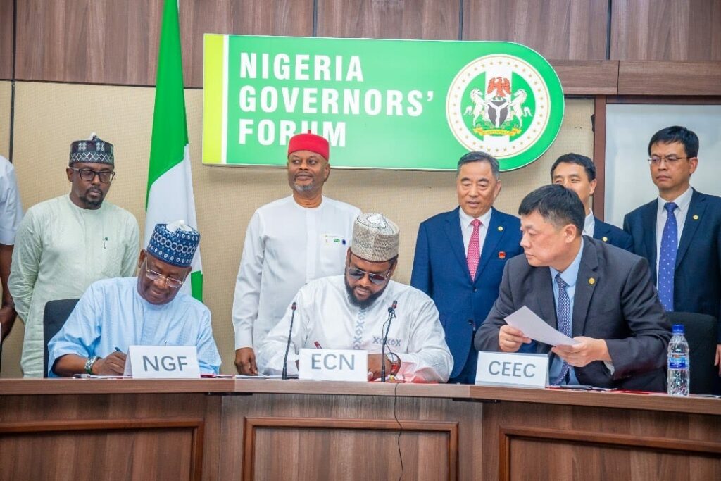 R-L (sitting) Abdulateef Shittu (DG NGF) signing on behalf of NGF Chairman, Mustapha Abdullahi DG CEO, ECN (m),  Signing (on behalf of the chairman Song Hai liang) Zhu Honggang, Executive President of China Energy International Group, North West Africa, Regional HQ. (Standing), L-R, Muhammad Magaji, Commissioner of Finance and Economic Development for Gombe State, Uche Nnaji Minister of Innovation, Science and Technology (m) and Song Hai liang – Chairman of China Energy Engineering Corporation Ltd (Energy China for short)